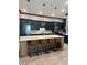 This is a spacious kitchen with a large island, pendant lighting, and modern appliances at 8825 Sw 57Th Place Rd, Ocala, FL 34481
