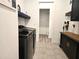 Functional laundry room with shelving, storage cabinets and modern washer and dryer at 8825 Sw 57Th Place Rd, Ocala, FL 34481