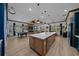 The open-concept living space includes a kitchen with a large island and a dining area, ideal for entertaining at 8825 Sw 57Th Place Rd, Ocala, FL 34481