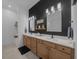 Elegant main bathroom featuring dual sinks, a decorative backsplash, and modern fixtures at 8825 Sw 57Th Place Rd, Ocala, FL 34481