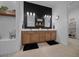 Modern main bathroom featuring dual sinks, elegant mirrors, and a walk-in shower at 8825 Sw 57Th Place Rd, Ocala, FL 34481