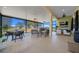Relaxing outdoor living area with comfortable seating and views of the backyard at 8825 Sw 57Th Place Rd, Ocala, FL 34481