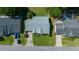 Aerial view of single-story home with well-maintained landscaping, driveway, and nearby trees at 8832 Sw 108Th St, Ocala, FL 34481