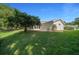 Spacious backyard with lush lawn and mature landscaping, perfect for outdoor activities and relaxation at 8832 Sw 108Th St, Ocala, FL 34481