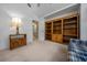 Bedroom featuring a unique window, built-in shelving, plush carpeting, and neutral-colored walls at 8832 Sw 108Th St, Ocala, FL 34481