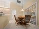 Cozy dining area with a round table, four chairs, and sliding glass doors to the patio at 8832 Sw 108Th St, Ocala, FL 34481