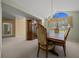 Formal dining room with a large window, chandelier, and ample space for entertaining guests at 8832 Sw 108Th St, Ocala, FL 34481