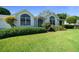 Charming single-story home featuring meticulously landscaped front yard at 8832 Sw 108Th St, Ocala, FL 34481