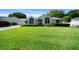 Charming single-story home with a meticulously maintained lawn and vibrant landscaping at 8832 Sw 108Th St, Ocala, FL 34481