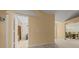 Hallway with doorways leading to various rooms in the house, neutral carpet and paint at 8832 Sw 108Th St, Ocala, FL 34481