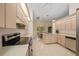 Well-lit kitchen with stainless steel appliances and light-colored wood cabinets at 8832 Sw 108Th St, Ocala, FL 34481