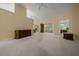 Open-concept living area with ample natural light and neutral carpeting at 8832 Sw 108Th St, Ocala, FL 34481