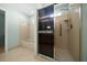 Bathroom featuring a tiled shower with a grab bar, a tub, and neutral walls at 8832 Sw 108Th St, Ocala, FL 34481