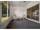 Enclosed sunroom featuring sliding glass doors and serene outdoor views at 8832 Sw 108Th St, Ocala, FL 34481