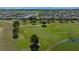 Aerial view of a home, golf course and the community, showcasing its desirable location and attractive surroundings at 8825 Sw 57Th Place Rd, Ocala, FL 34481