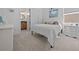Cozy bedroom with an ensuite bathroom, comfortable queen bed, and ample natural light at 8825 Sw 57Th Place Rd, Ocala, FL 34481