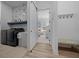 Modern laundry room featuring black appliances, stylish tile, and convenient storage solutions at 8825 Sw 57Th Place Rd, Ocala, FL 34481