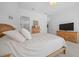 Comfortable main bedroom with neutral decor, a plush bed, and ample natural light creates a serene and inviting atmosphere at 8825 Sw 57Th Place Rd, Ocala, FL 34481