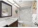 Well-lit bathroom features a modern vanity, tub and shower combination with tiled walls at 1000 Woodward Oaks Cir, Eustis, FL 32726