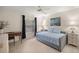 Cozy bedroom with wood-look floors, a daybed, and a desk at 1000 Woodward Oaks Cir, Eustis, FL 32726