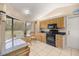 Bright kitchen with stainless steel appliances, breakfast table and natural light at 1000 Woodward Oaks Cir, Eustis, FL 32726