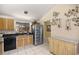 Well-lit kitchen featuring modern appliances and seamless counter space perfect for cooking at 1000 Woodward Oaks Cir, Eustis, FL 32726