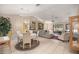 Inviting living room featuring tile flooring, neutral tones, and a comfortable seating arrangement at 1000 Woodward Oaks Cir, Eustis, FL 32726
