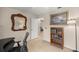 Bright office features a stylish desk, decorative mirror, and a charming bookcase at 1000 Woodward Oaks Cir, Eustis, FL 32726