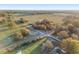 Expansive aerial view showcasing a beautiful property near open fields and a serene landscape at 10495 Sw 100Th Ave, Ocala, FL 34481
