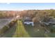 Aerial view of home on large lot with mature trees and green lawn at 10495 Sw 100Th Ave, Ocala, FL 34481