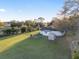 Aerial view of fenced backyard with shed and well-maintained lawn at 10495 Sw 100Th Ave, Ocala, FL 34481