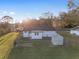 Aerial view of fenced backyard with shed and well-maintained lawn at 10495 Sw 100Th Ave, Ocala, FL 34481