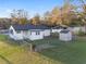 Aerial view of fenced backyard with shed and well-maintained lawn at 10495 Sw 100Th Ave, Ocala, FL 34481