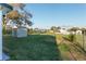 View of the spacious backyard and storage shed, perfect for outdoor enjoyment and storage at 10495 Sw 100Th Ave, Ocala, FL 34481