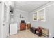 The bonus room features tile flooring and a door to the exterior of the home at 10495 Sw 100Th Ave, Ocala, FL 34481