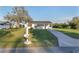 Inviting home with manicured landscaping and a traditional mailbox, creating a warm, welcoming atmosphere at 10495 Sw 100Th Ave, Ocala, FL 34481