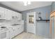 Cozy kitchen featuring all white appliances, plenty of counter space and bright light at 10495 Sw 100Th Ave, Ocala, FL 34481