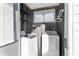 Functional laundry room with washer and dryer, providing convenience and efficiency at 10495 Sw 100Th Ave, Ocala, FL 34481