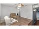 Open living room featuring hardwood floors, comfortable seating and gray walls at 10495 Sw 100Th Ave, Ocala, FL 34481