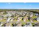 Aerial view showcases neighborhood and home's central location with lush surrounding greenery at 11013 Se 169Th Pl, Summerfield, FL 34491