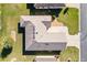 Overhead view displays a house's roof, immaculate lawn, and landscaping, highlighting the property's well-kept exterior at 11013 Se 169Th Pl, Summerfield, FL 34491