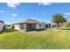 Spacious backyard showcases lush lawn and screened patio, perfect for outdoor enjoyment at 11013 Se 169Th Pl, Summerfield, FL 34491