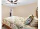 Comfortable bedroom with a ceiling fan, neutral walls, and plenty of natural light at 11013 Se 169Th Pl, Summerfield, FL 34491