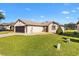 Charming single-story home features well-manicured lawn, inviting curb appeal and attached garage at 11013 Se 169Th Pl, Summerfield, FL 34491