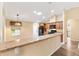 Bright kitchen with granite countertops, pendant lighting, ample cabinet space, and modern appliances at 11013 Se 169Th Pl, Summerfield, FL 34491