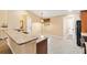Eat-in kitchen with tile floors, granite countertops, pendant lighting, and ample cabinet space at 11013 Se 169Th Pl, Summerfield, FL 34491