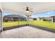 Enjoy outdoor living on this screened lanai with brick pavers and views of the backyard at 11013 Se 169Th Pl, Summerfield, FL 34491
