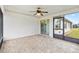 Screened-in patio with brick floor and fan provides a great outdoor living space at 11013 Se 169Th Pl, Summerfield, FL 34491