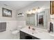 Renovated bathroom featuring a white sink, a tiled shower, and modern fixtures at 1300 Ne 53Rd St, Ocala, FL 34479