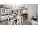 Inviting dining area with stylish chandelier and view to the game room at 1300 Ne 53Rd St, Ocala, FL 34479